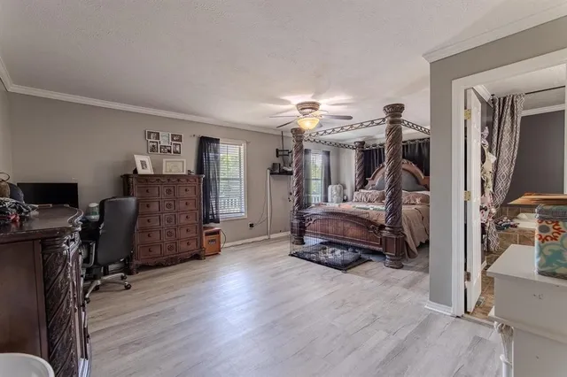 a view of a workspace with furniture and gym equipment