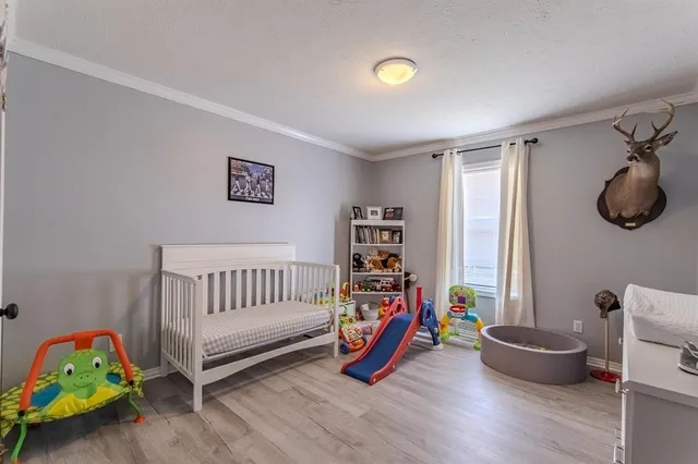 a bathroom with a toilet a sink and a mirror