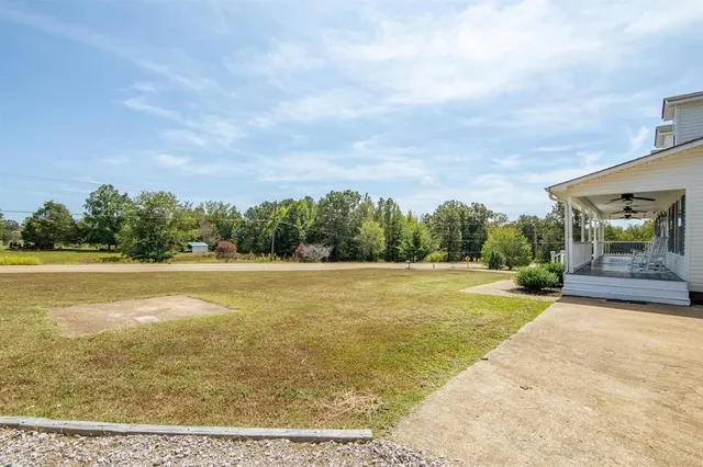 a view of a porch with wooden floor