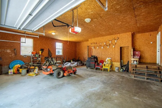 a view of a patio with table and chairs with wooden floor