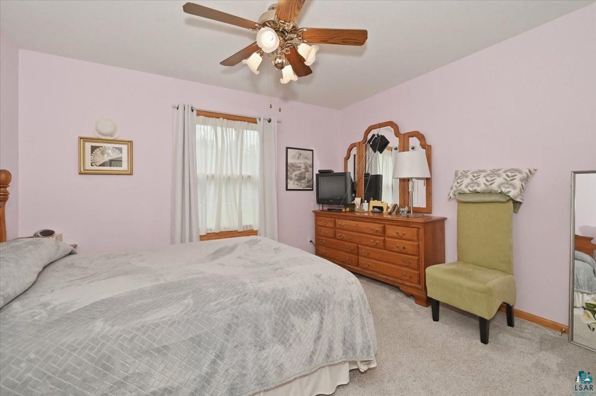 8162 South Dowling Road West Superior, WI 54880 - Photo 7 of 15 Carpeted bedroom with a ceiling fan light fixture