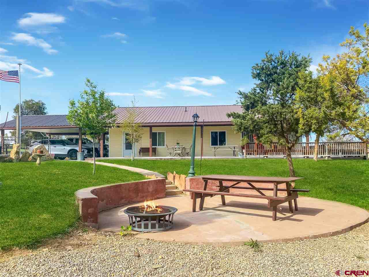 34354 3575th Road Redvale, CO 81431 - Photo 1 of 30 a view of a house with a yard porch and sitting area