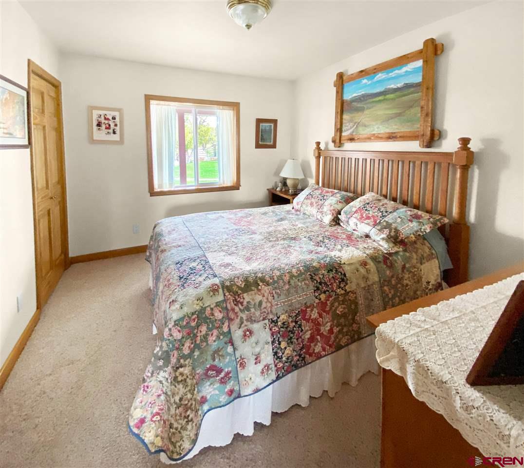 34354 3575th Road Redvale, CO 81431 - Photo 15 of 30 a bedroom with a bed and a window