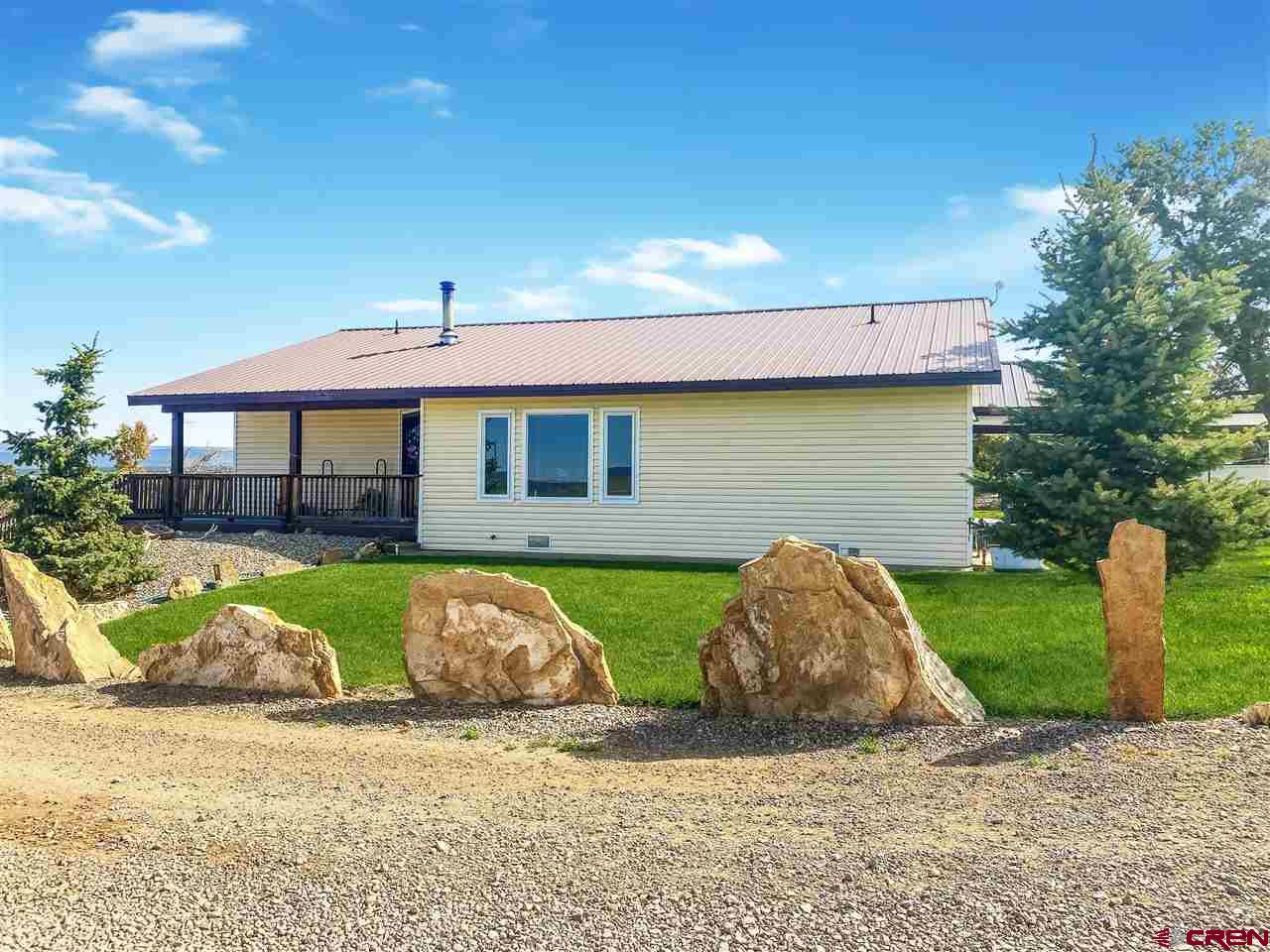 34354 3575th Road Redvale, CO 81431 - Photo 2 of 30 a front view of a house with garden