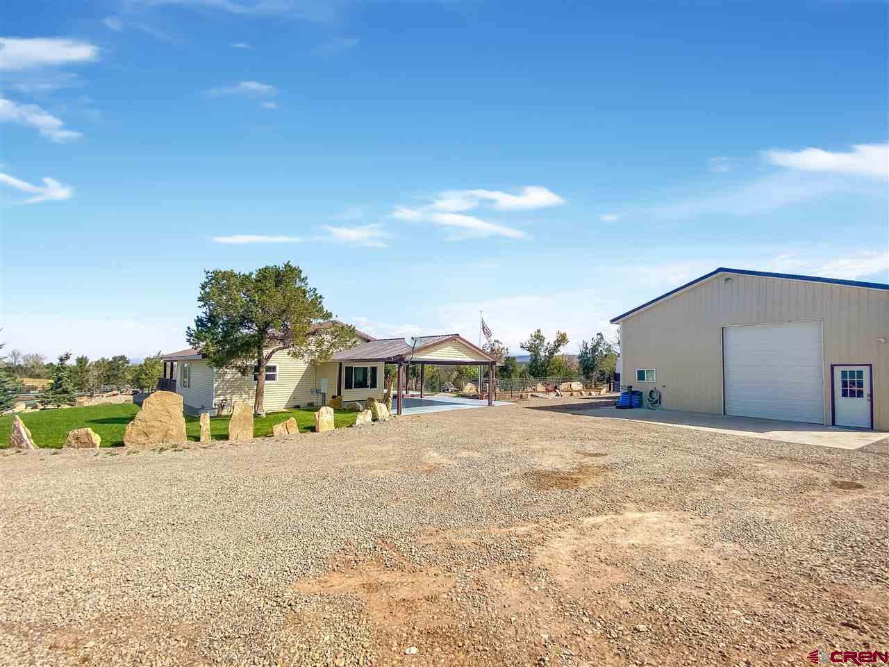 34354 3575th Road Redvale, CO 81431 - Photo 3 of 30 a view of a house with a yard and sitting area
