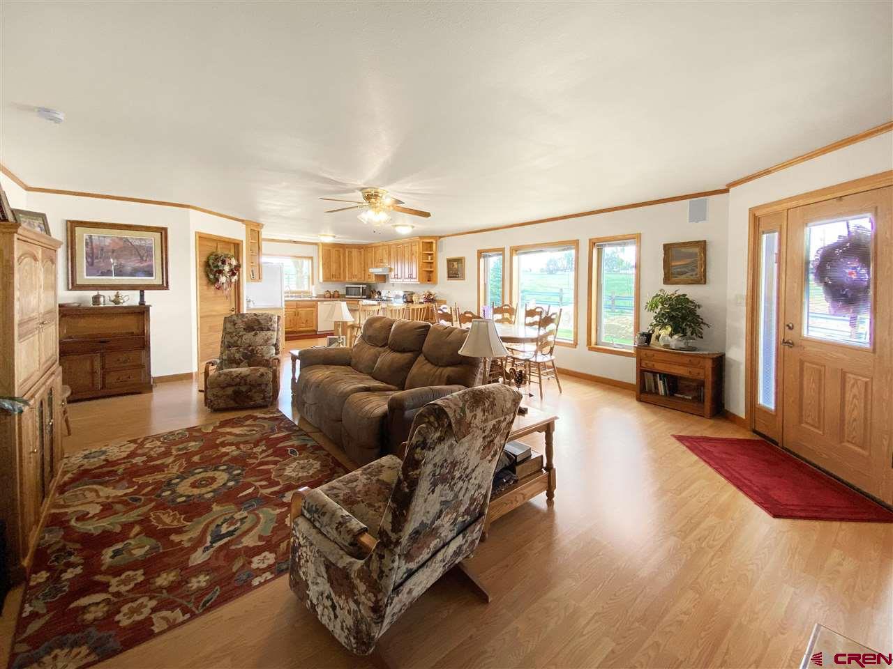 34354 3575th Road Redvale, CO 81431 - Photo 8 of 30 a living room with furniture and a flat screen tv