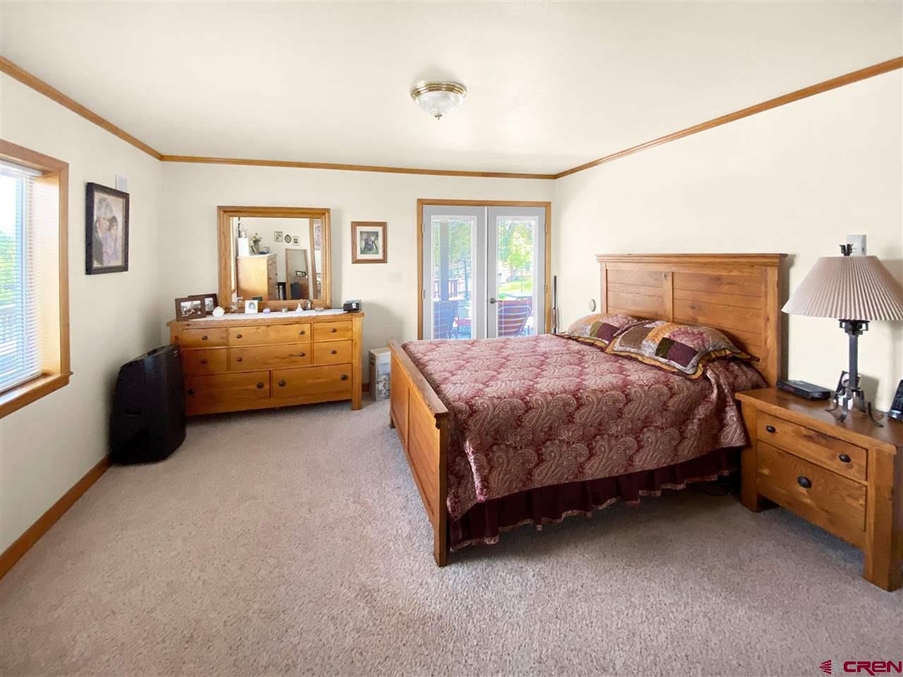 34354 3575th Road Redvale, CO 81431 - Photo 10 of 30 a spacious bedroom with a bed and window