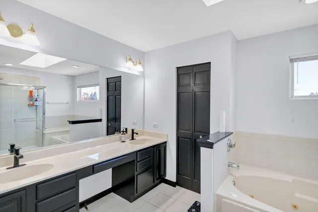 a bedroom with furniture and a flat screen tv