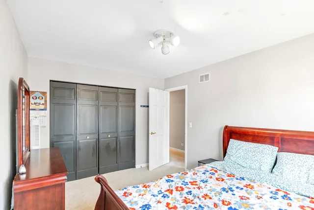 a bathroom with a sink a large mirror and vanity