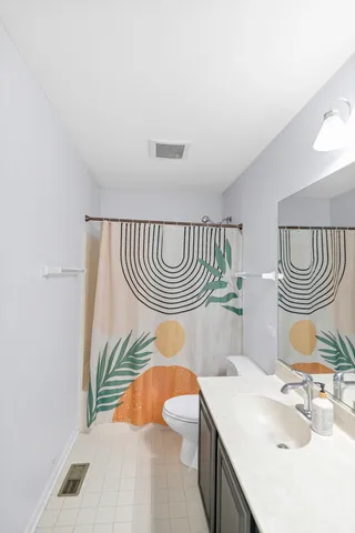 a living room with furniture fireplace and a large window