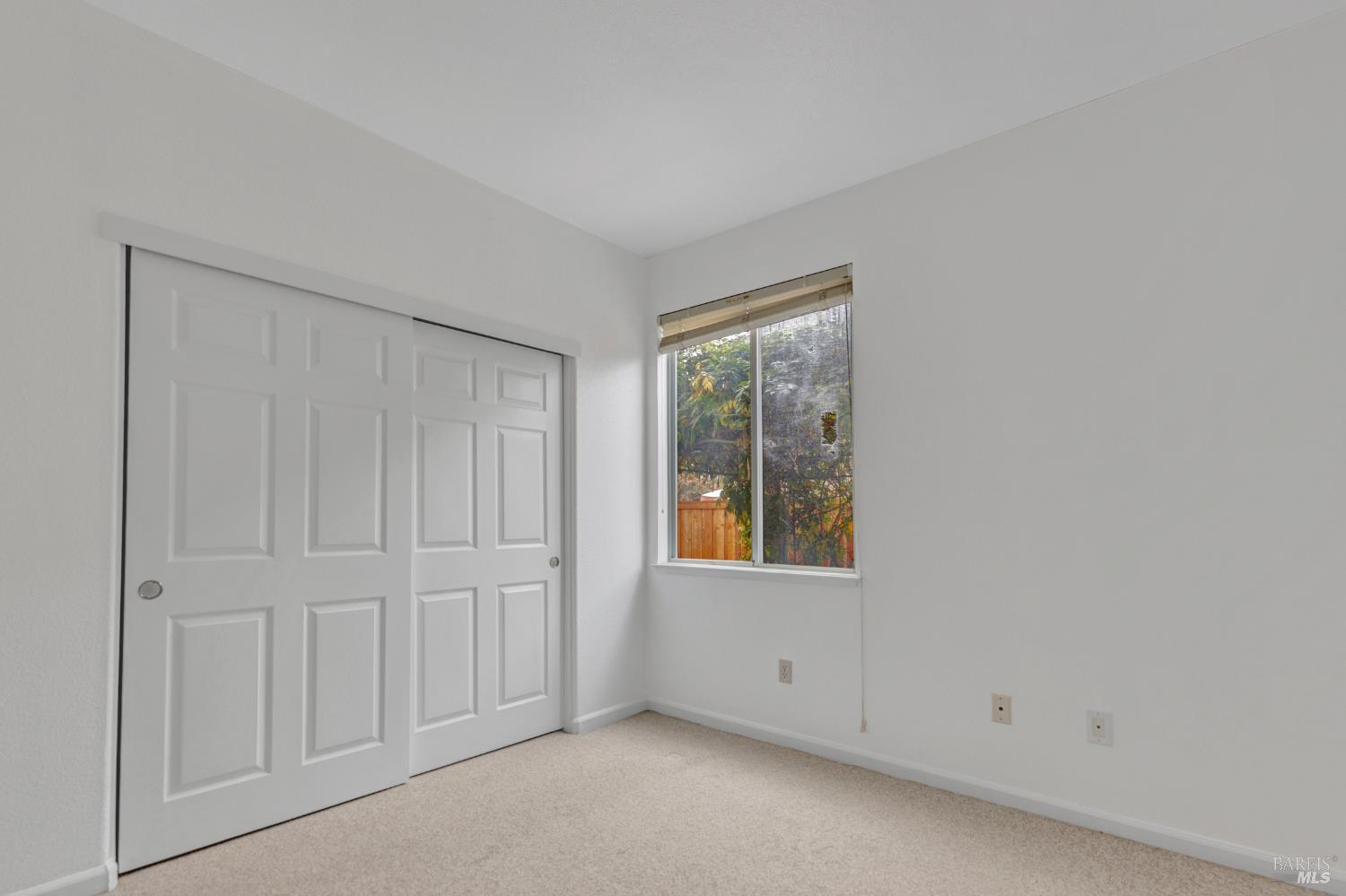 131 Sheila Court Vallejo, CA 94591 - Photo 13 of 36 The first-level bedroom offers privacy, making it an ideal guest room.