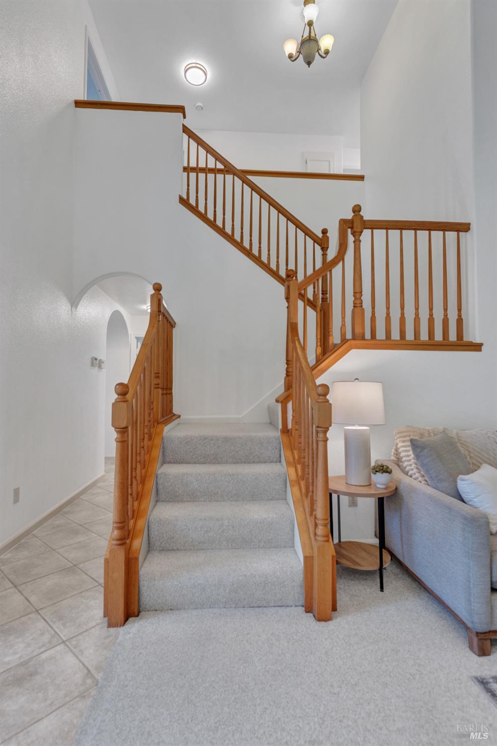 131 Sheila Court Vallejo, CA 94591 - Photo 15 of 36 A gracefully designed stairway leads to the upper level, where the primary suite, additional bedrooms, and a versatile office or guest room await.