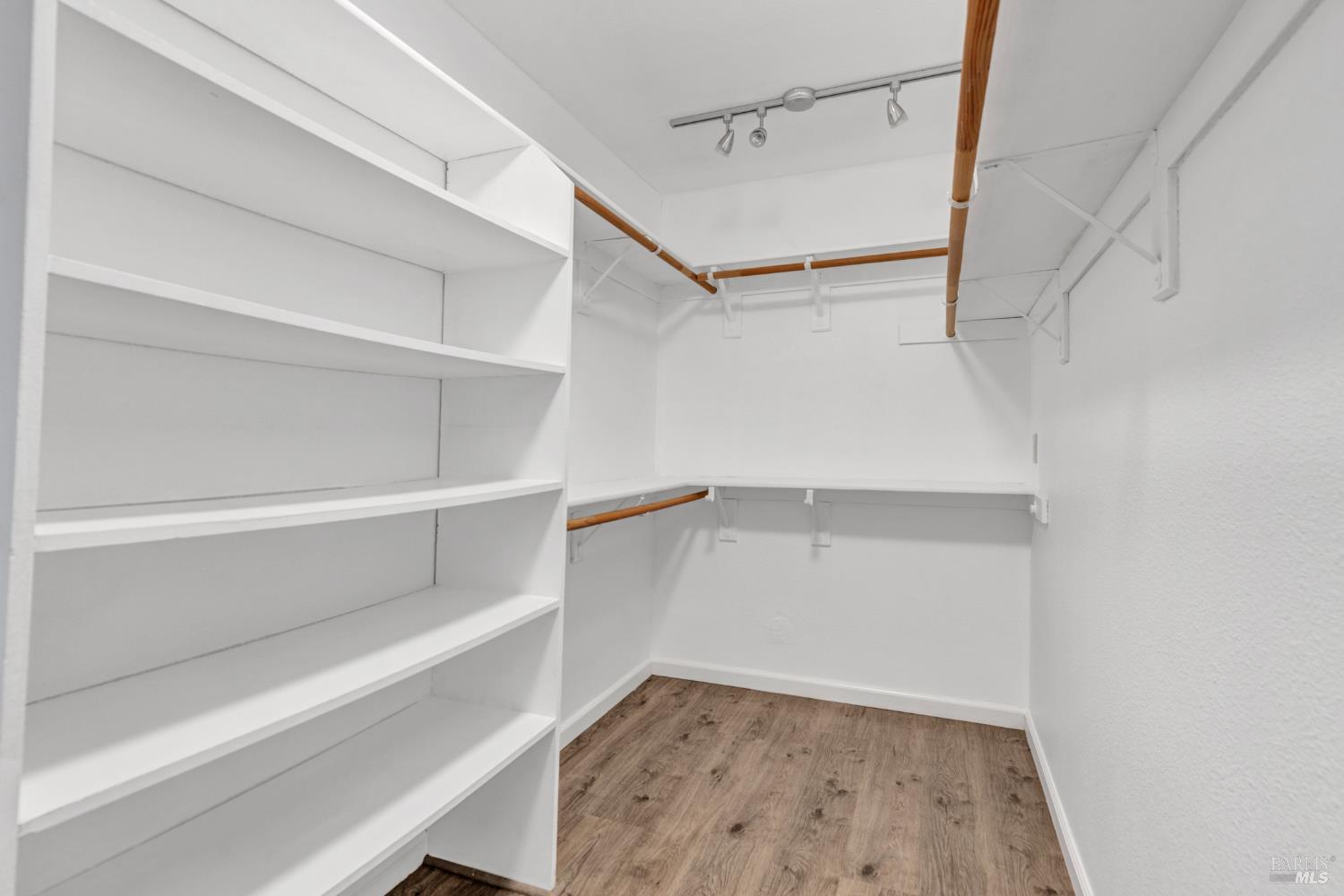 131 Sheila Court Vallejo, CA 94591 - Photo 20 of 36 An expansive walk-in closet provides ample space for organized storage, featuring customized shelving and hanging areas to accommodate a diverse wardrobe.