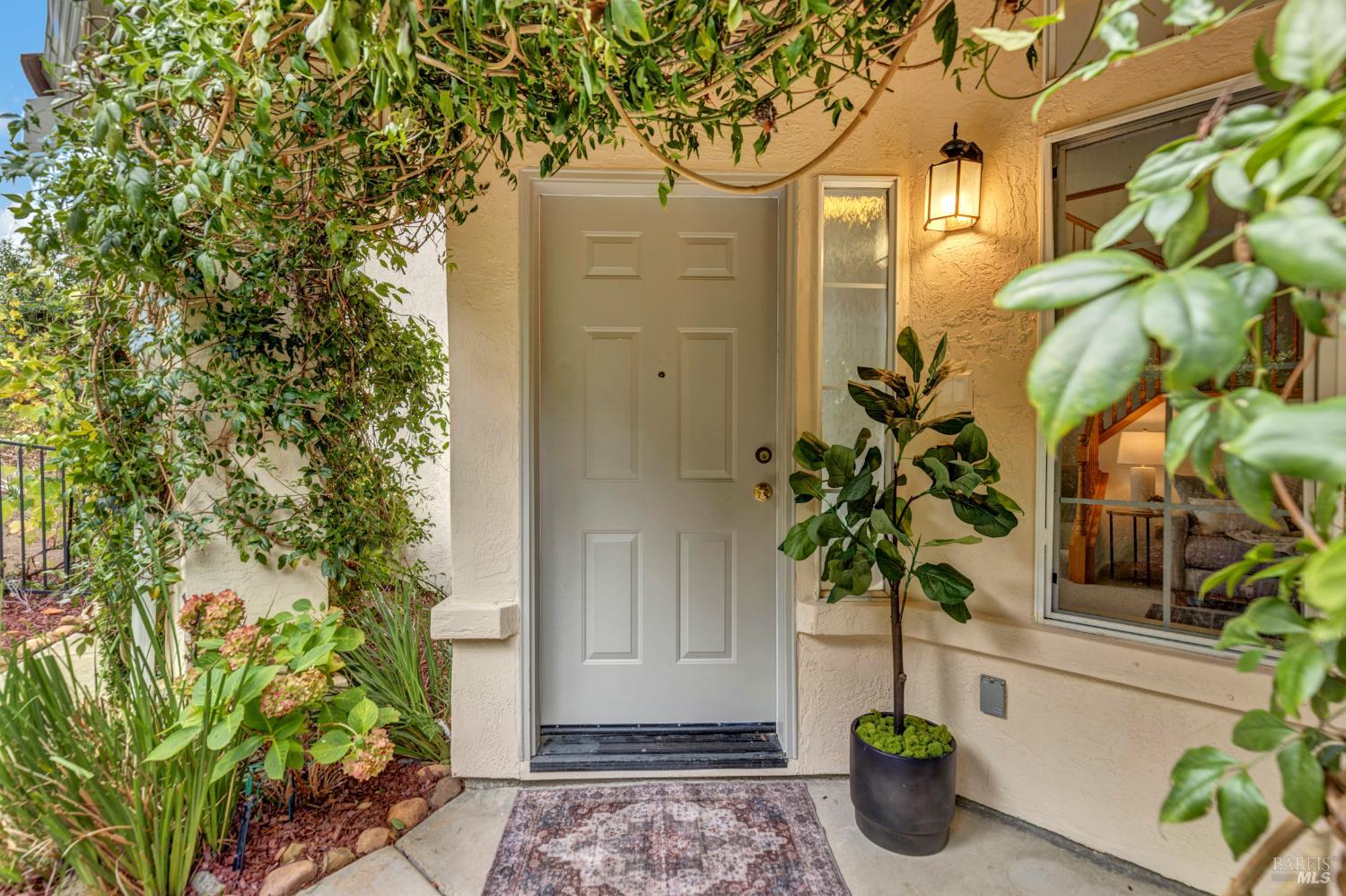 131 Sheila Court Vallejo, CA 94591 - Photo 3 of 36 Step into to a beautifully landscaped front entryway. Lush greenery line the pathway, creating a vibrant and serene atmosphere.