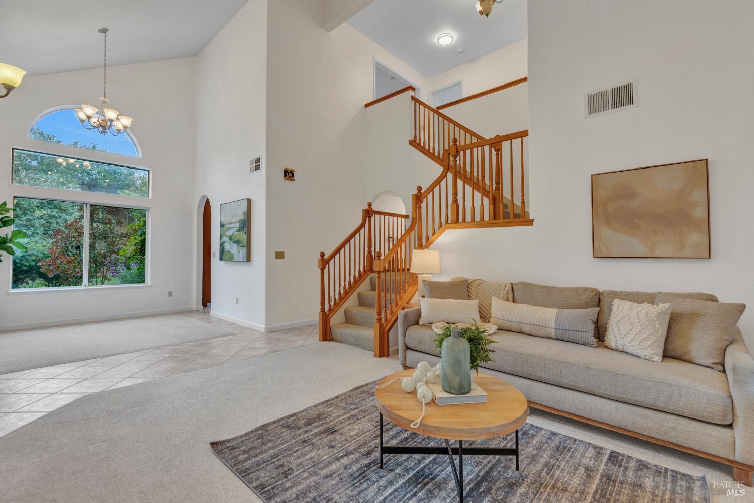 131 Sheila Court Vallejo, CA 94591 - Photo 4 of 36 Experience a living and dining area filled with bright natural light and enhanced by tall ceilings, offering a spacious and open feel. This seamless space is perfect for both entertaining and relaxation.