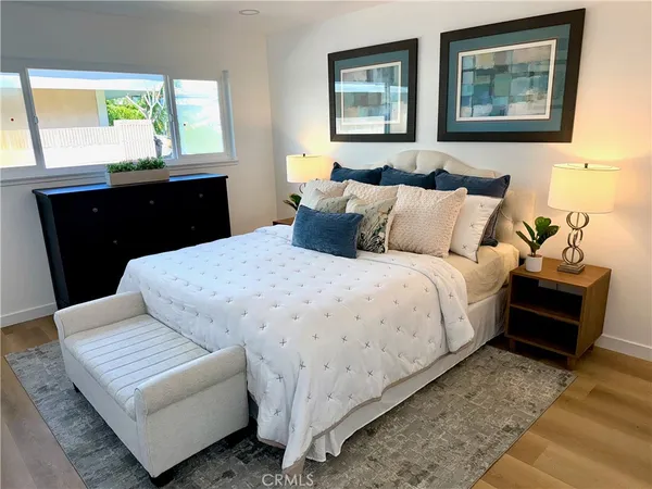 a bedroom with bed and window