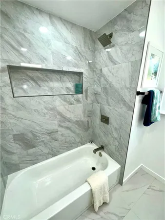 a table with a potted plant and a window