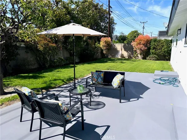 a view of a swimming pool and lounge chairs