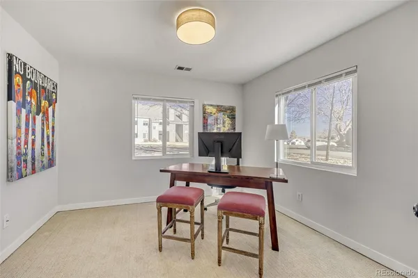 a dining room with furniture and window