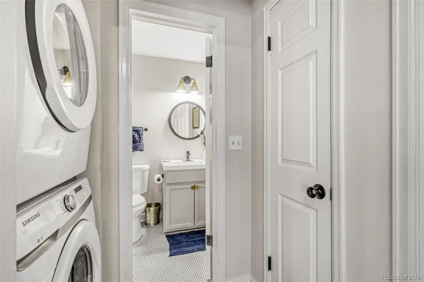 a view of a storage & utility room with dryer and washer