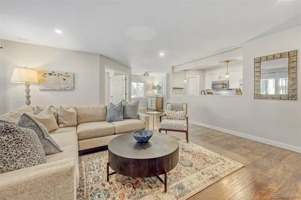 a living room with furniture and a rug