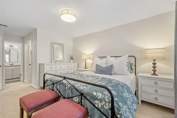 a bedroom with a bed and a cabinets