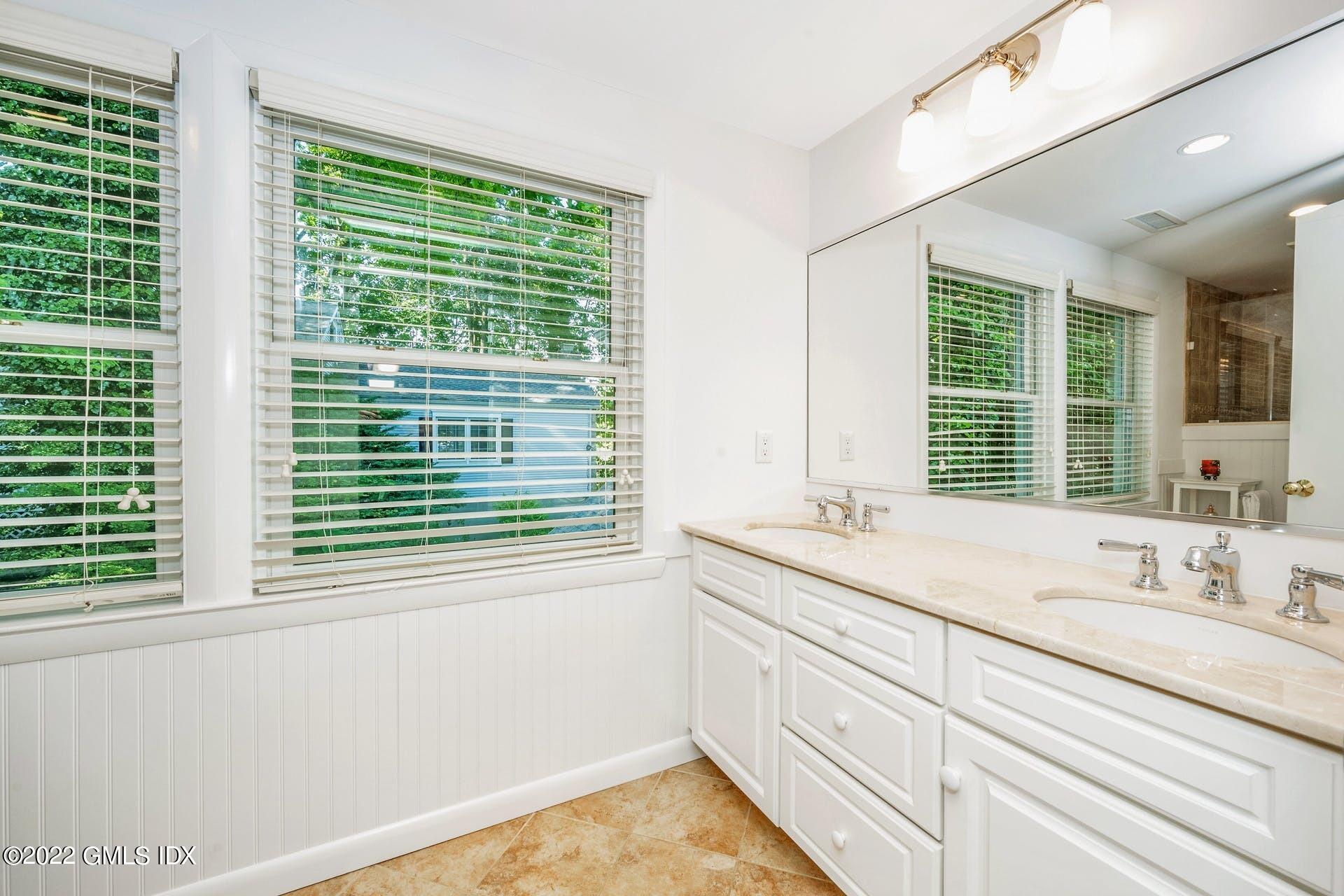 48 Valleywood Road Cos Cob, CT 06830 - Photo 11 of 25 a bathroom with a sink and a window