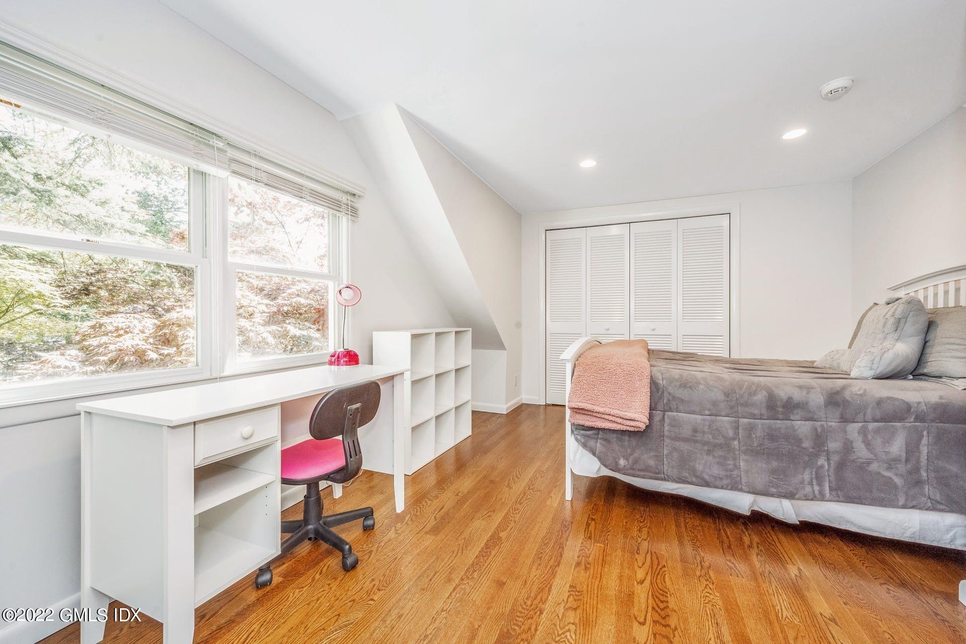48 Valleywood Road Cos Cob, CT 06830 - Photo 12 of 25 a living room with a couch and a table