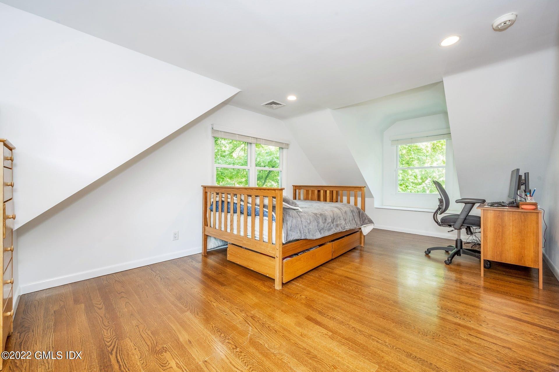 48 Valleywood Road Cos Cob, CT 06830 - Photo 14 of 25 a view of a room with wooden floor and a window