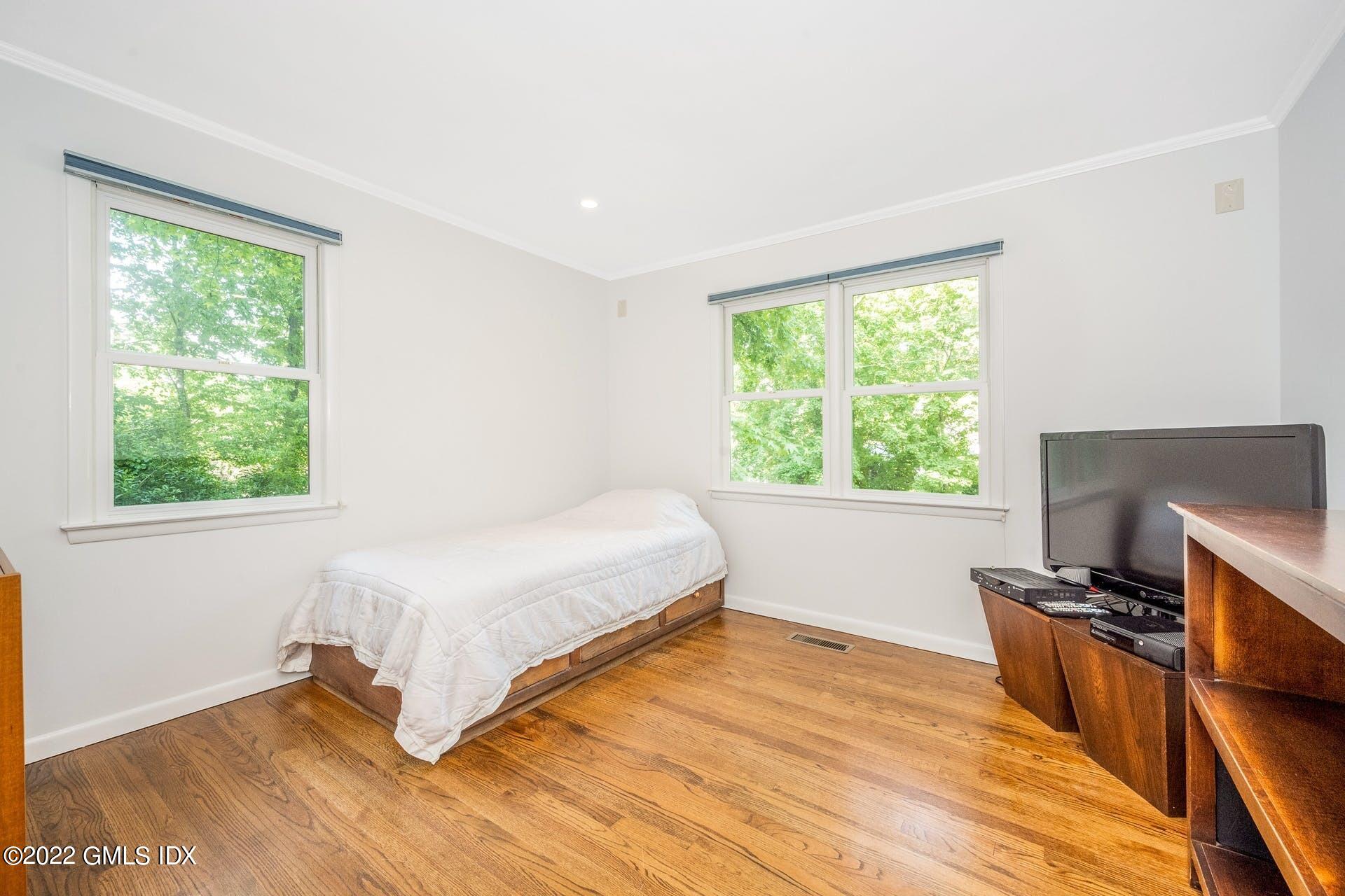 48 Valleywood Road Cos Cob, CT 06830 - Photo 15 of 25 a bedroom with a bed and a window