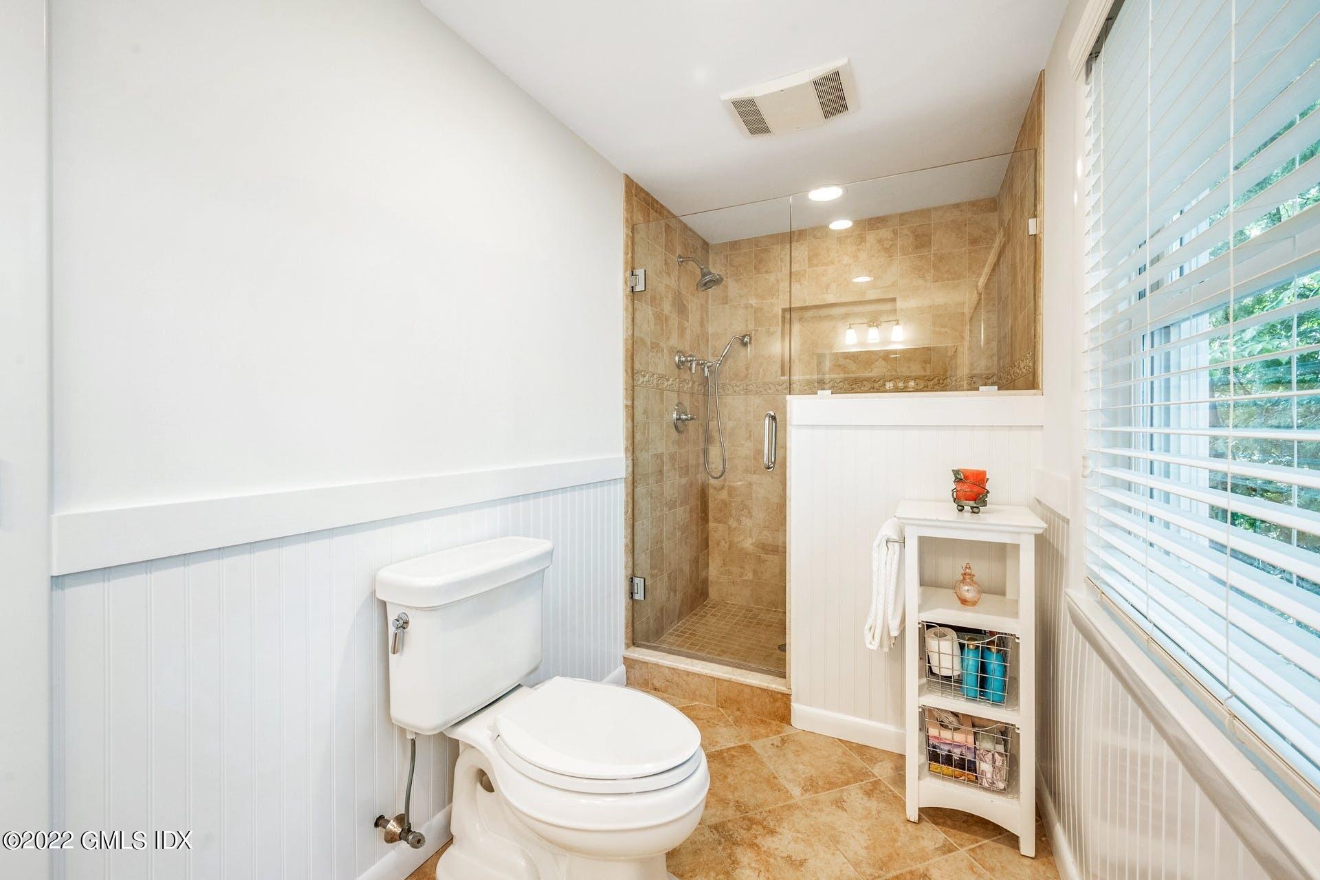 48 Valleywood Road Cos Cob, CT 06830 - Photo 10 of 25 a bathroom with a toilet and a shower