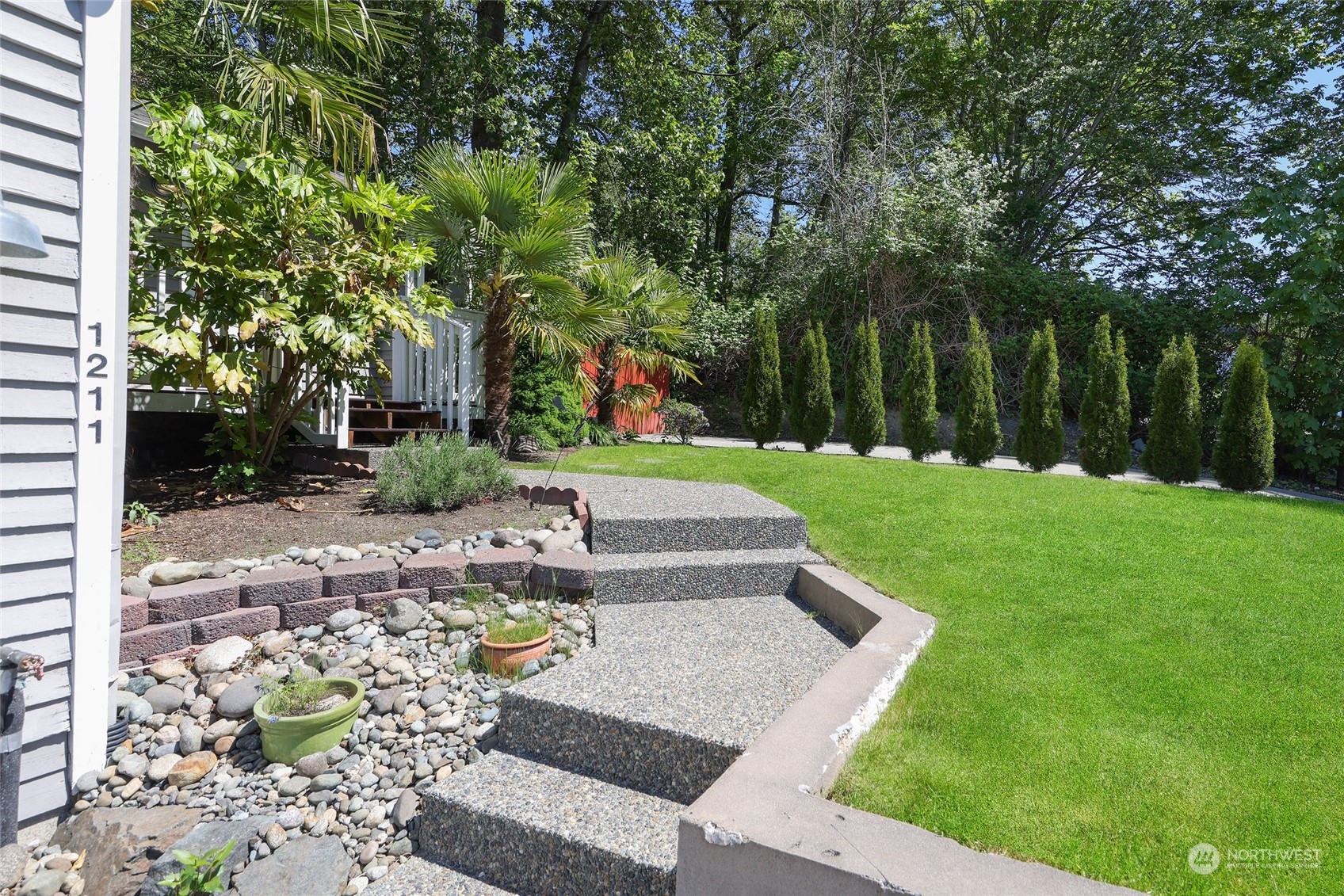 1211 232nd Place Southwest Bothell, WA 98021 - Photo 25 of 30 a view of a yard with plants