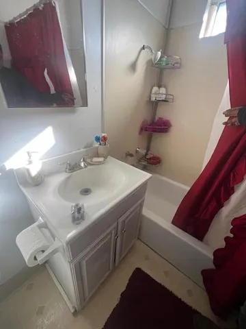a bathroom with a sink and a mirror