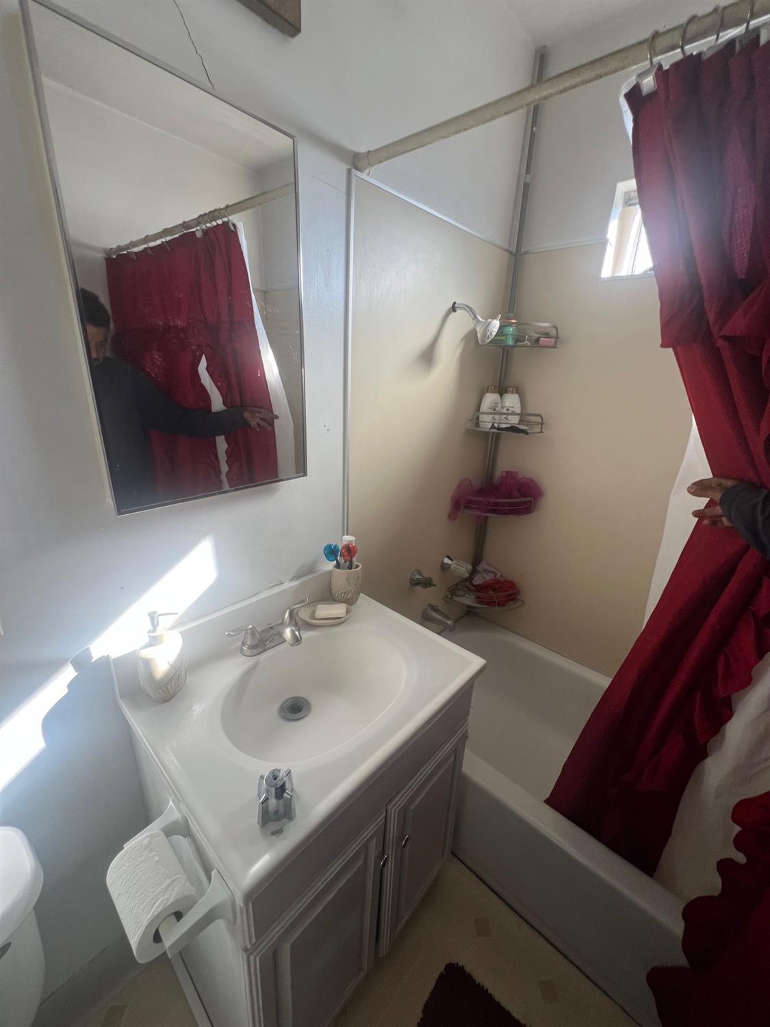 5202 Thurman Way Sacramento, CA 95824 - Photo 4 of 24 a bathroom with a sink and a mirror