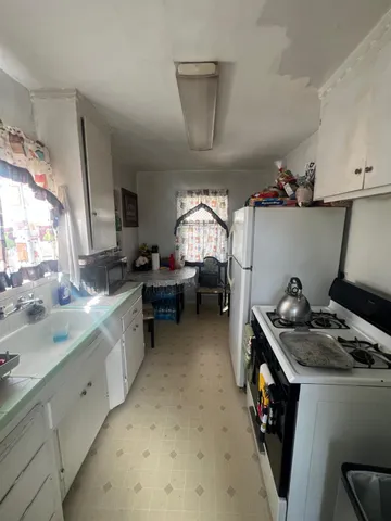 a kitchen that has a sink and a stove