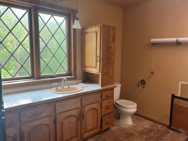 4196 East Evans Creek Road Rogue River, OR 97537 - Photo 23 of 36 a bathroom with a sink a toilet and a window