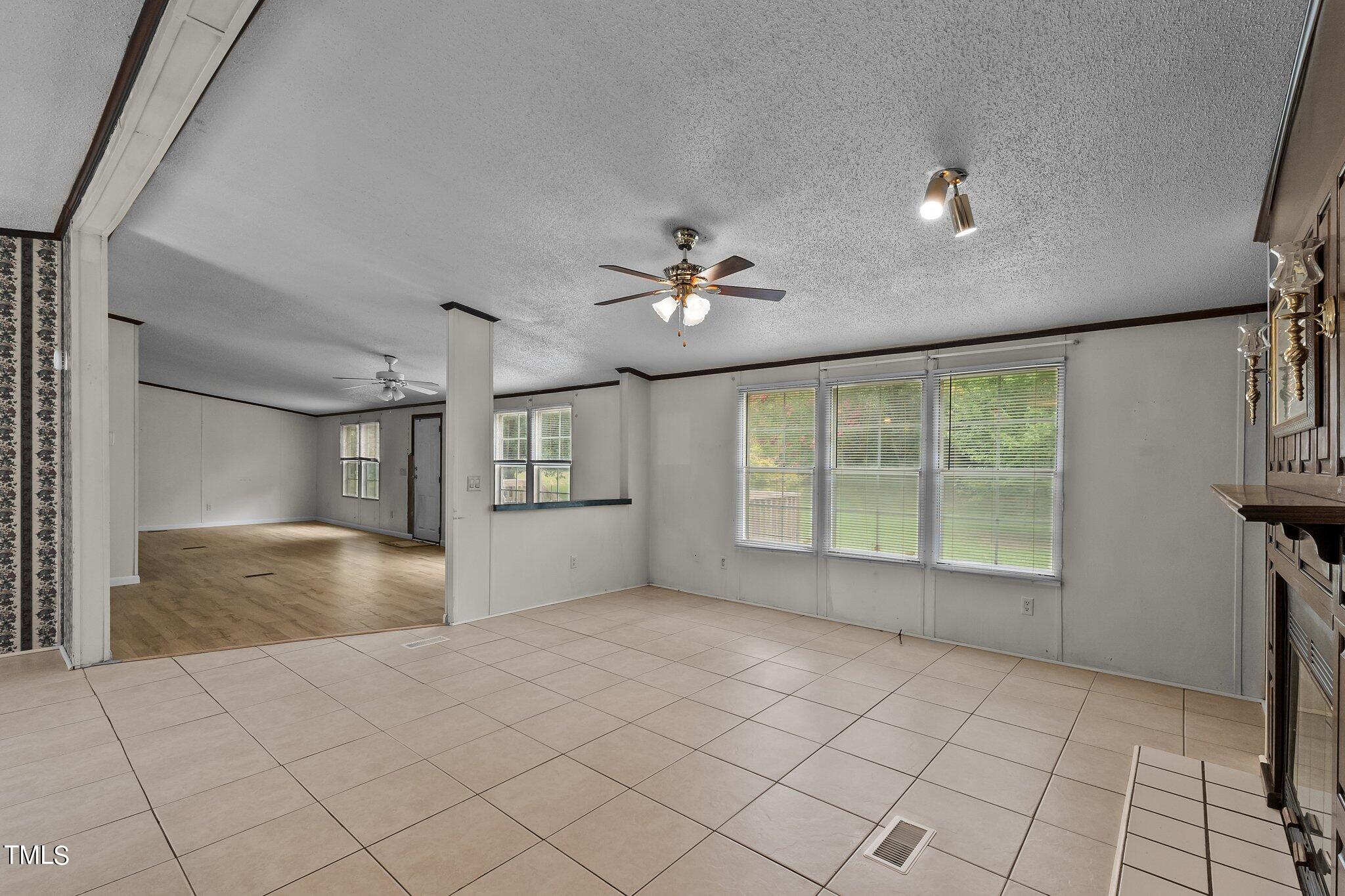 5612 Zacks Mill Road Angier, NC 27501 - Photo 12 of 42 a view of an empty room with a window