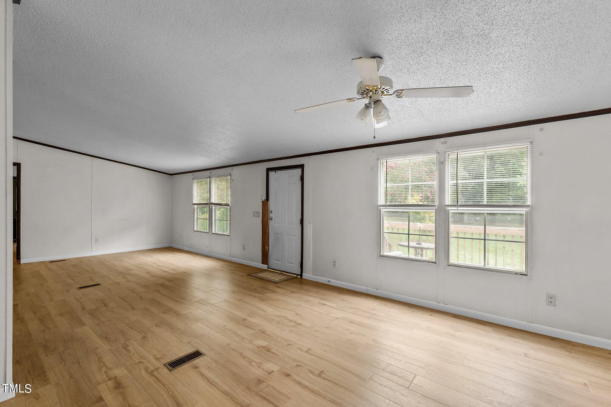 5612 Zacks Mill Road Angier, NC 27501 - Photo 14 of 42 a view of an empty room with a window