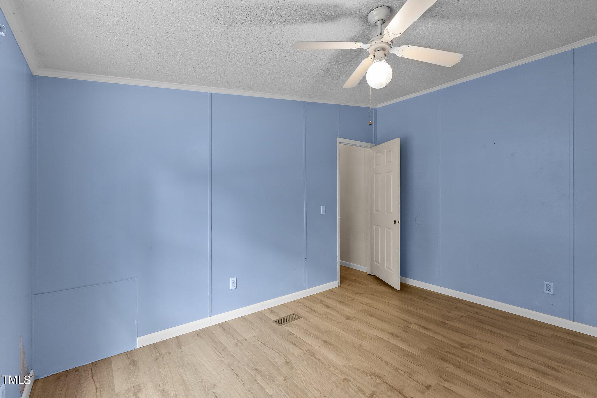 5612 Zacks Mill Road Angier, NC 27501 - Photo 25 of 42 wooden floor in an empty room