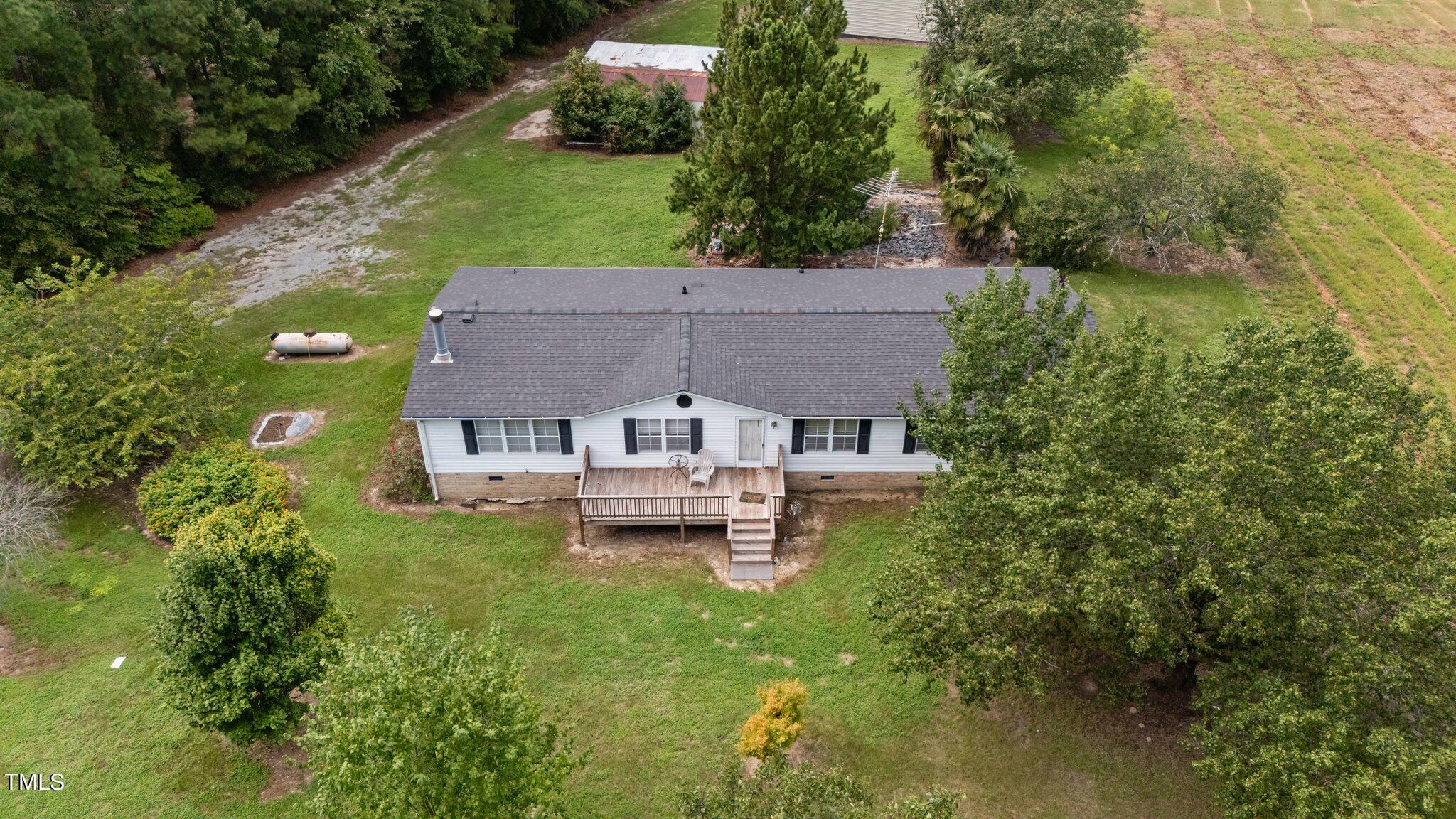 5612 Zacks Mill Road Angier, NC 27501 - Photo 28 of 42 an aerial view of a house with a garden