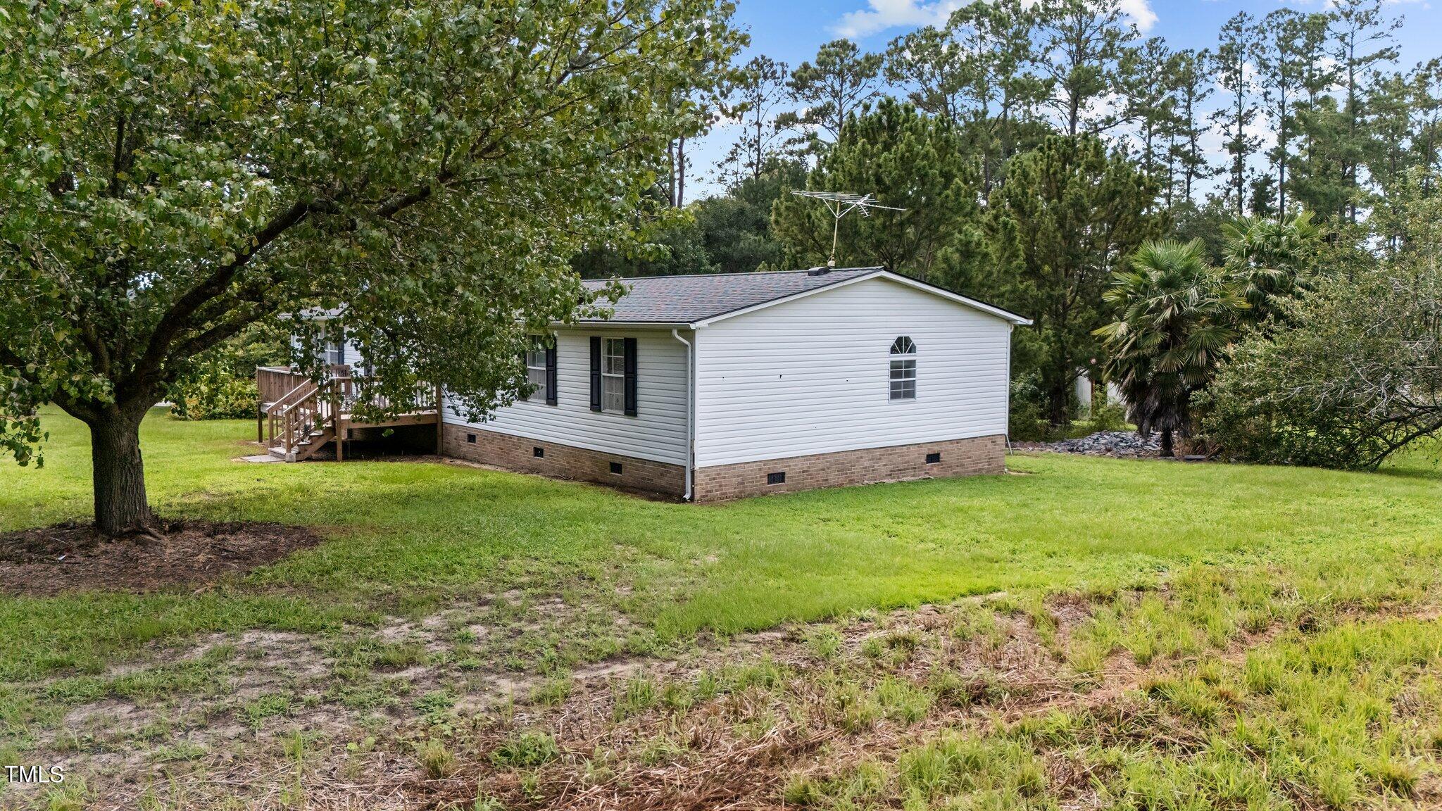 5612 Zacks Mill Road Angier, NC 27501 - Photo 29 of 42 a front view of house with yard and green space