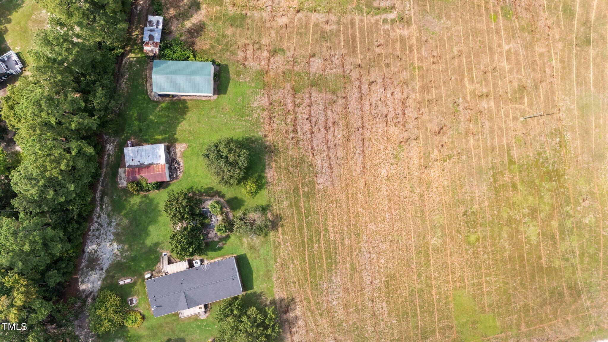 5612 Zacks Mill Road Angier, NC 27501 - Photo 34 of 42 a view of a house with a yard and plants