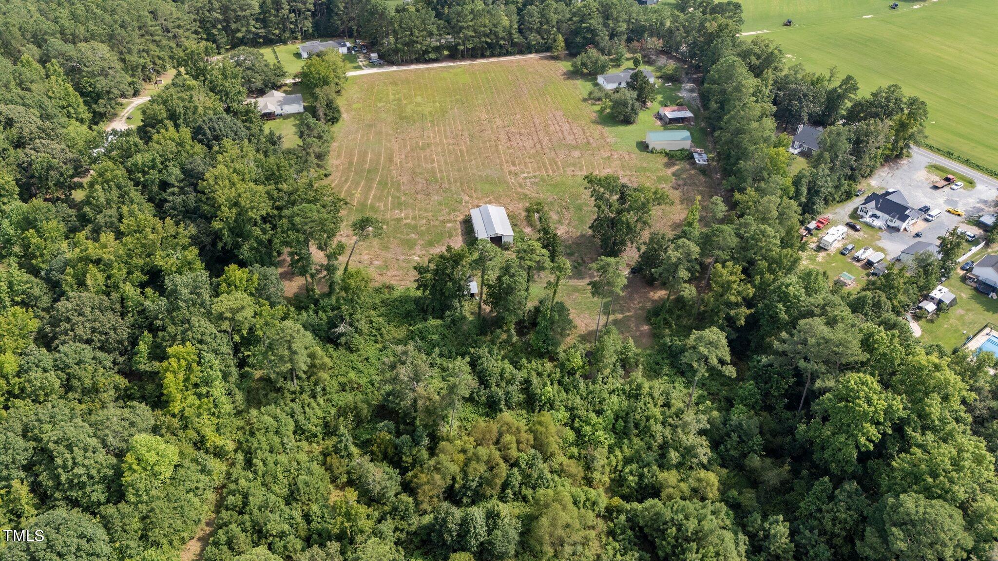5612 Zacks Mill Road Angier, NC 27501 - Photo 35 of 42 an aerial view of residential house with outdoor space and trees all around