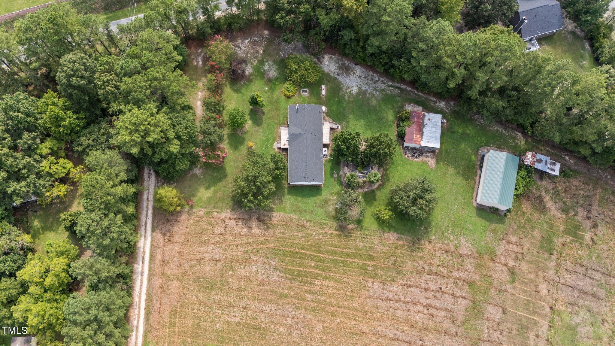 5612 Zacks Mill Road Angier, NC 27501 - Photo 36 of 42 a backyard of a house with lots of green space
