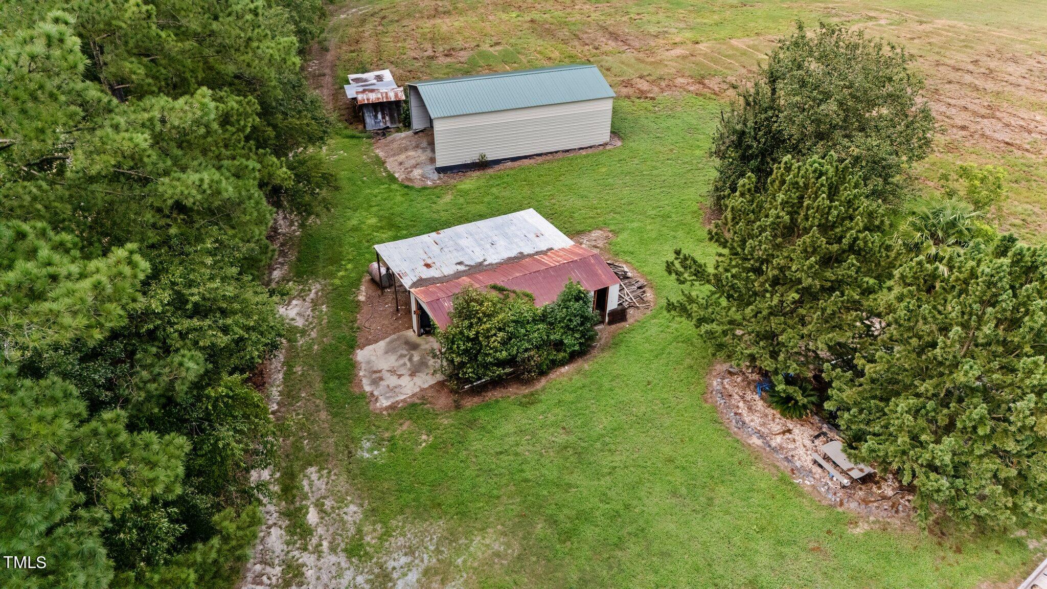 5612 Zacks Mill Road Angier, NC 27501 - Photo 41 of 42 an aerial view of a house with a garden