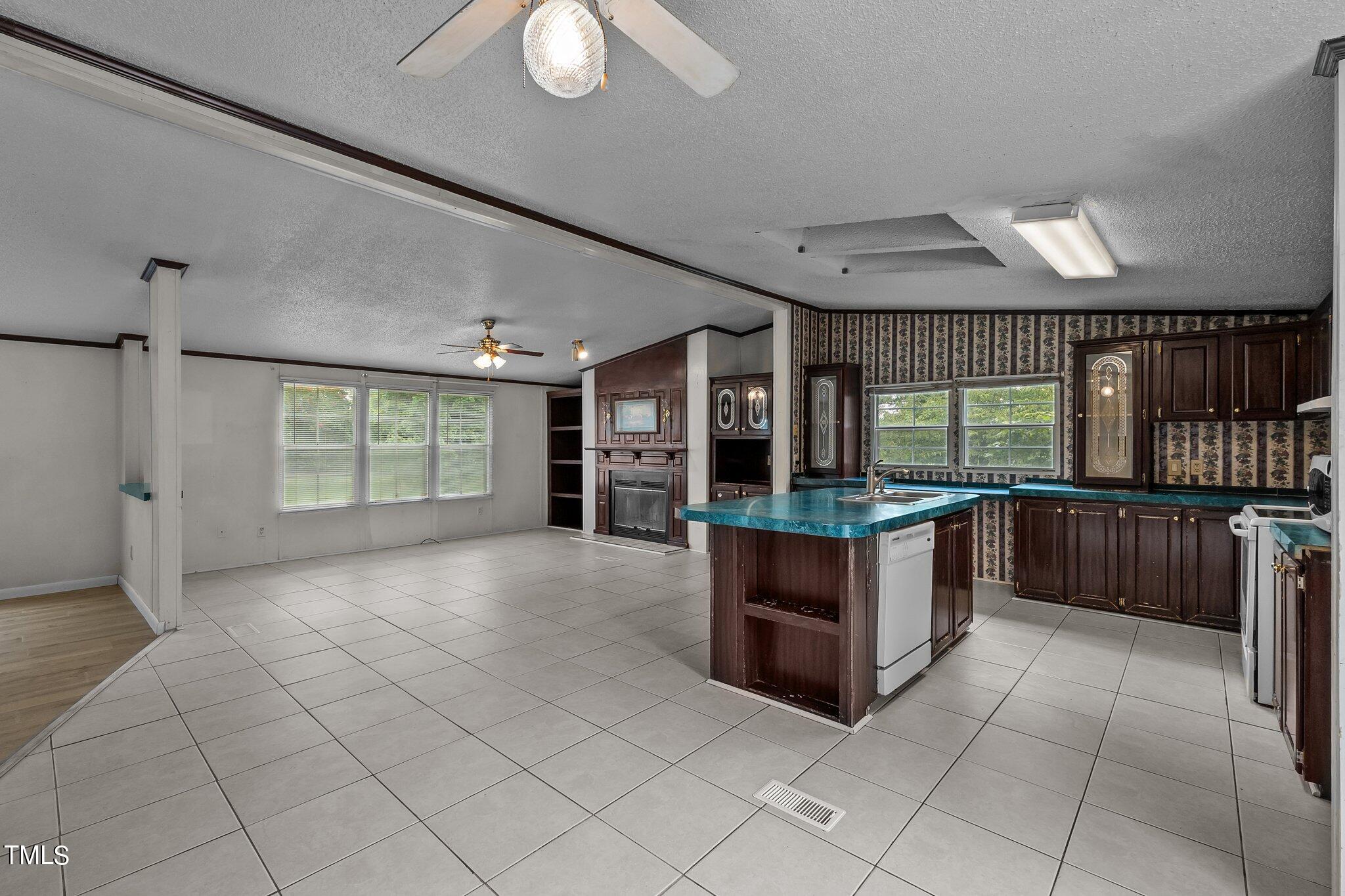 5612 Zacks Mill Road Angier, NC 27501 - Photo 8 of 42 a large room with a large window and kitchen view