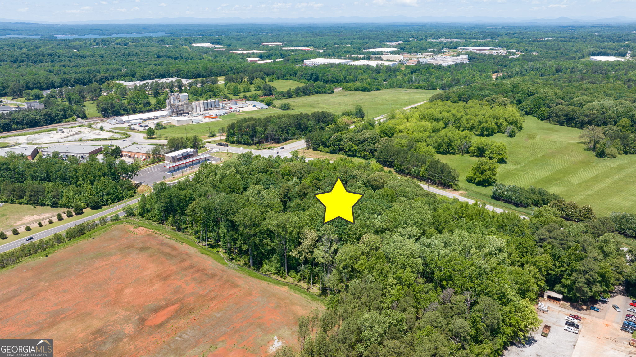 4611 Thurmon Tanner Road Flowery Branch, GA 30542 - Photo 11 of 23 an aerial view of lake residential houses with outdoor space and swimming pool