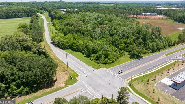 an aerial view of lake residential houses with outdoor space and river