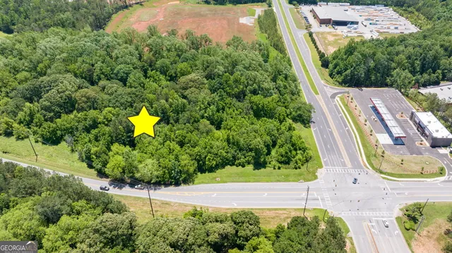 an aerial view of residential houses with outdoor space and swimming pool