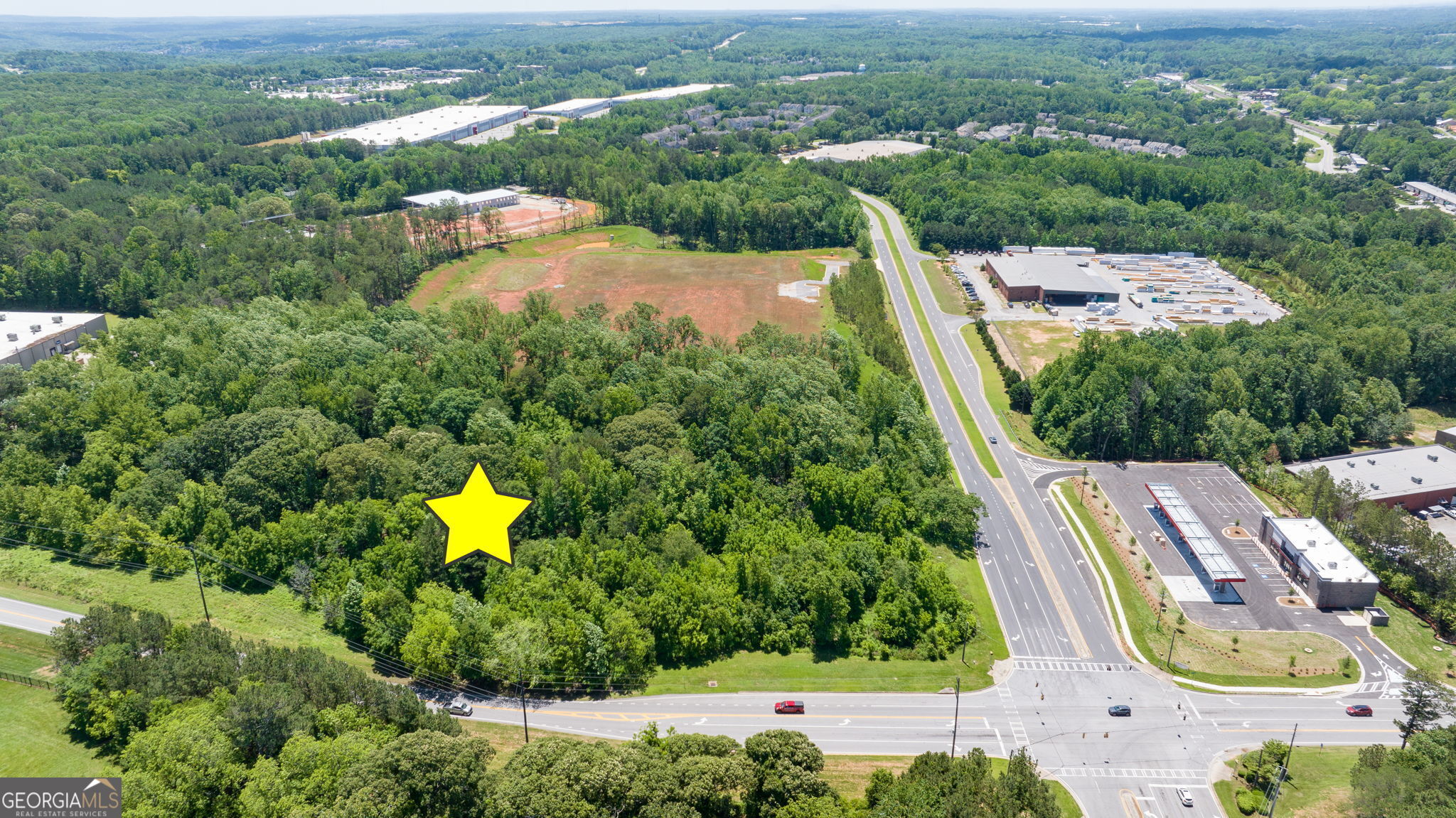 4611 Thurmon Tanner Road Flowery Branch, GA 30542 - Photo 5 of 23 an aerial view of residential houses with outdoor space and swimming pool